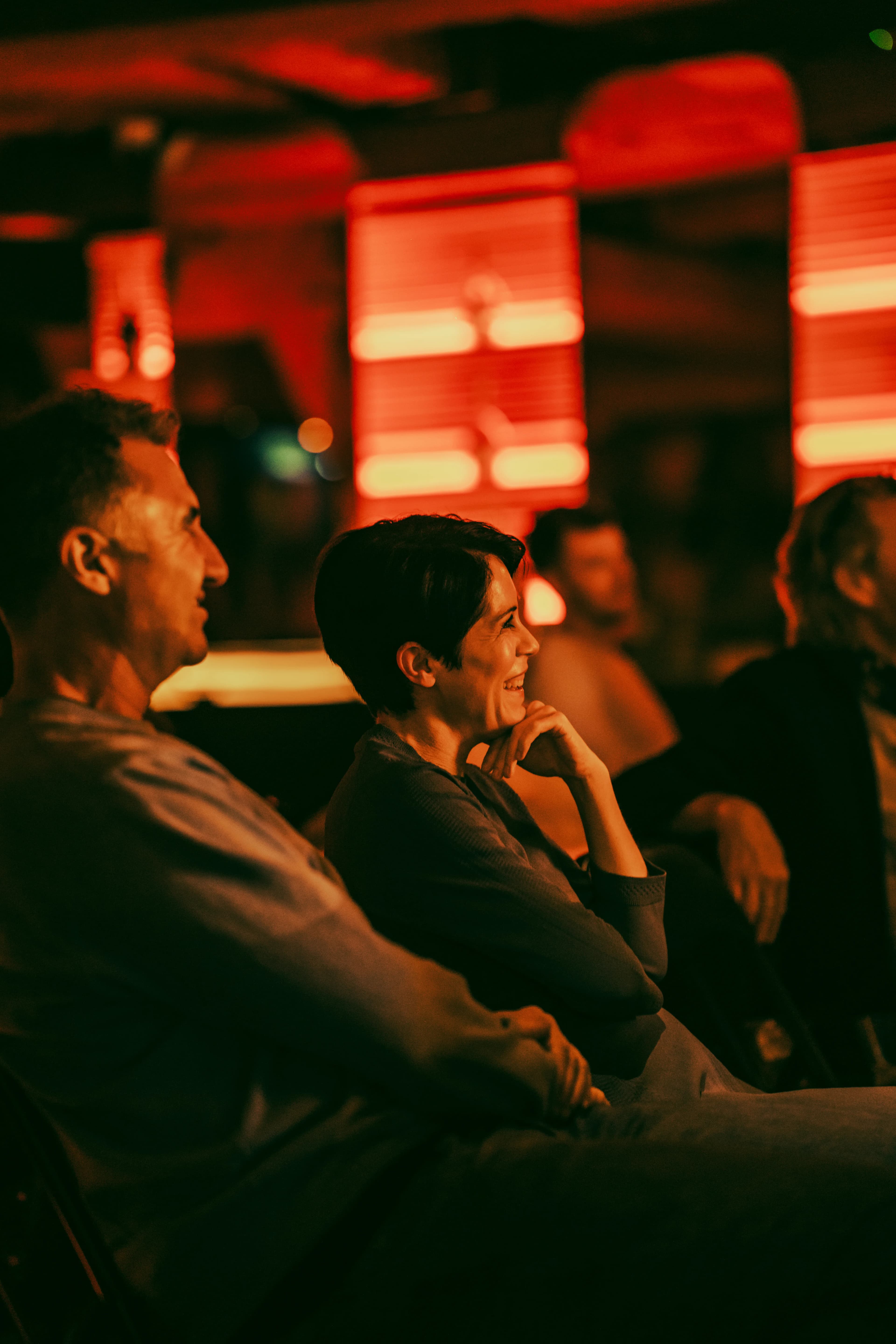 An audience member mid-laugh