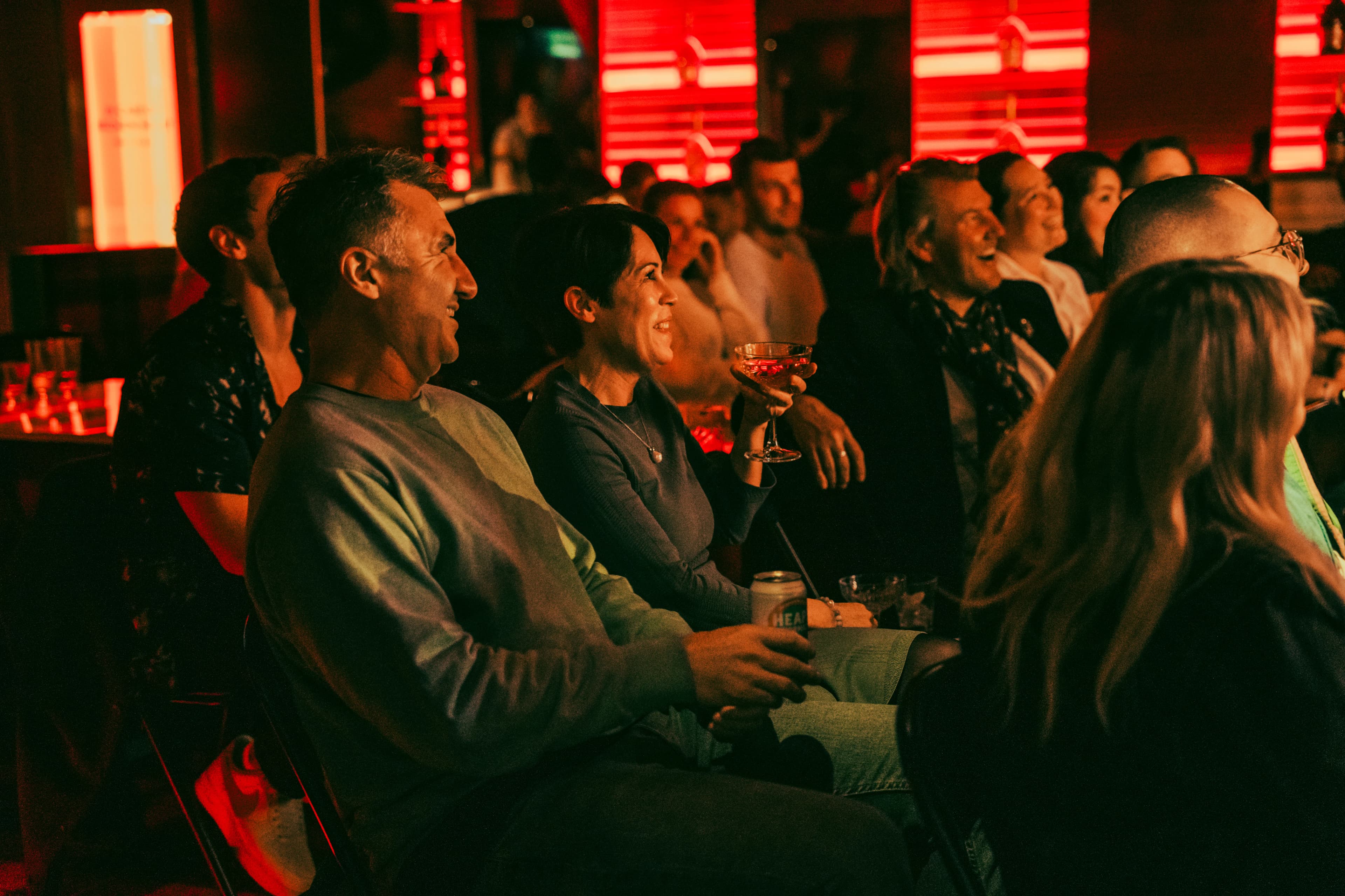 A full row of the audience cracking up